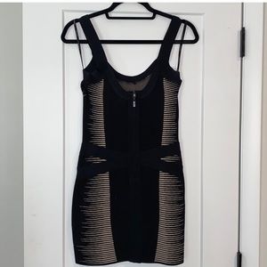 Beautiful little black body con dress with a touch of flair.